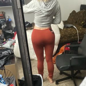 Tags on rust leggings
